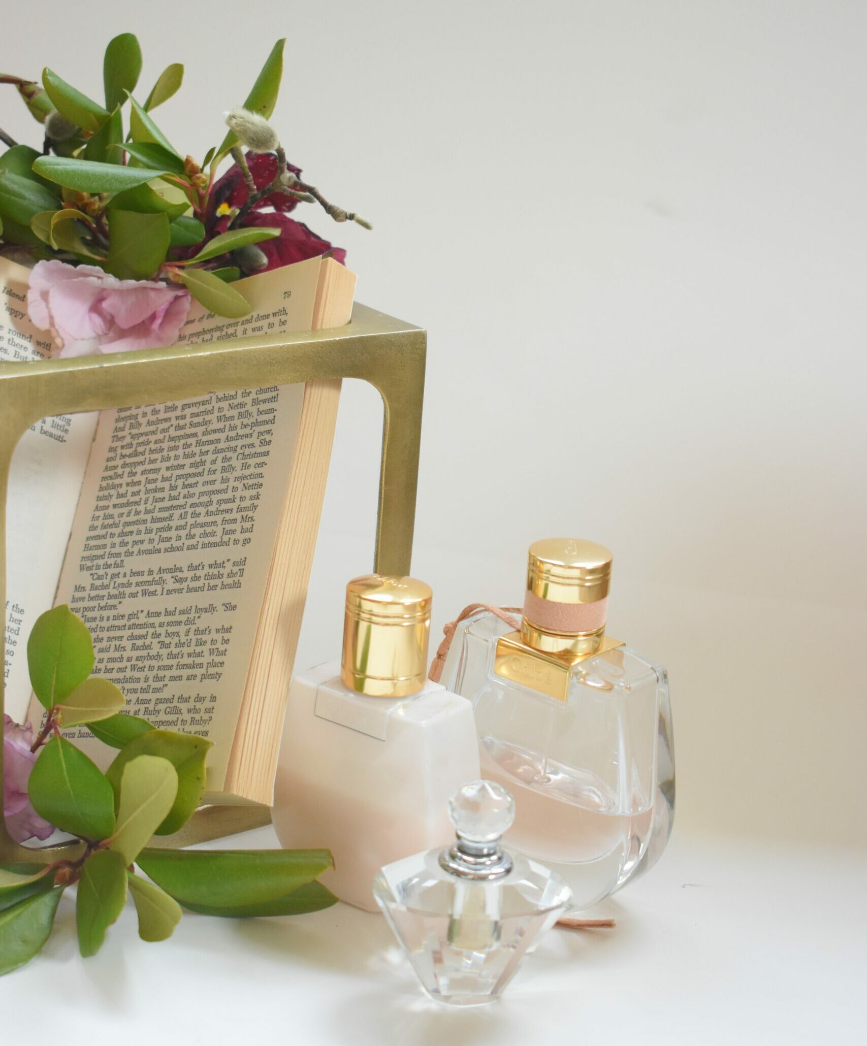 Perfume with books and flowers
