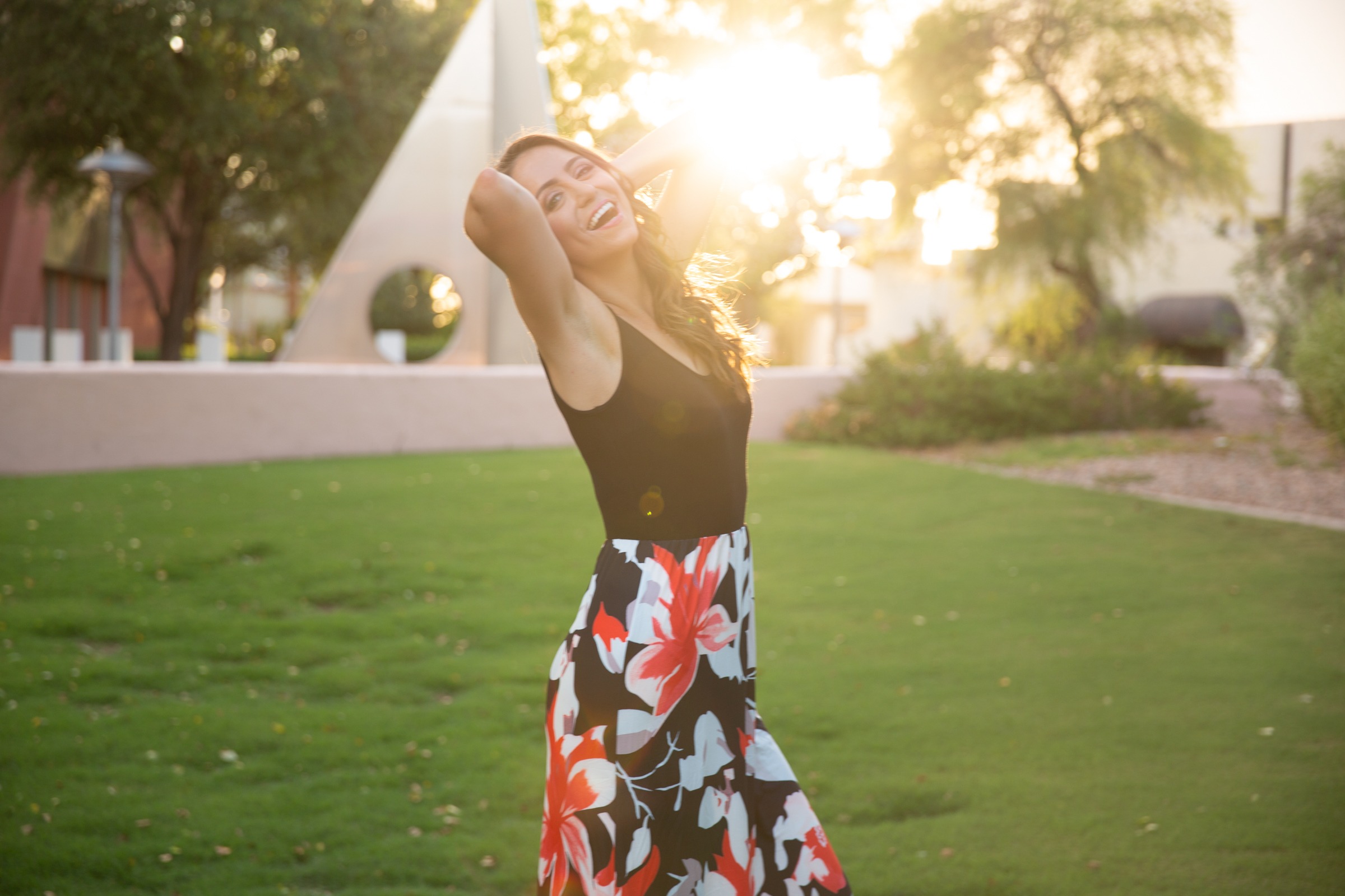 Dr. Nikoleta outside in a sundress at sunset