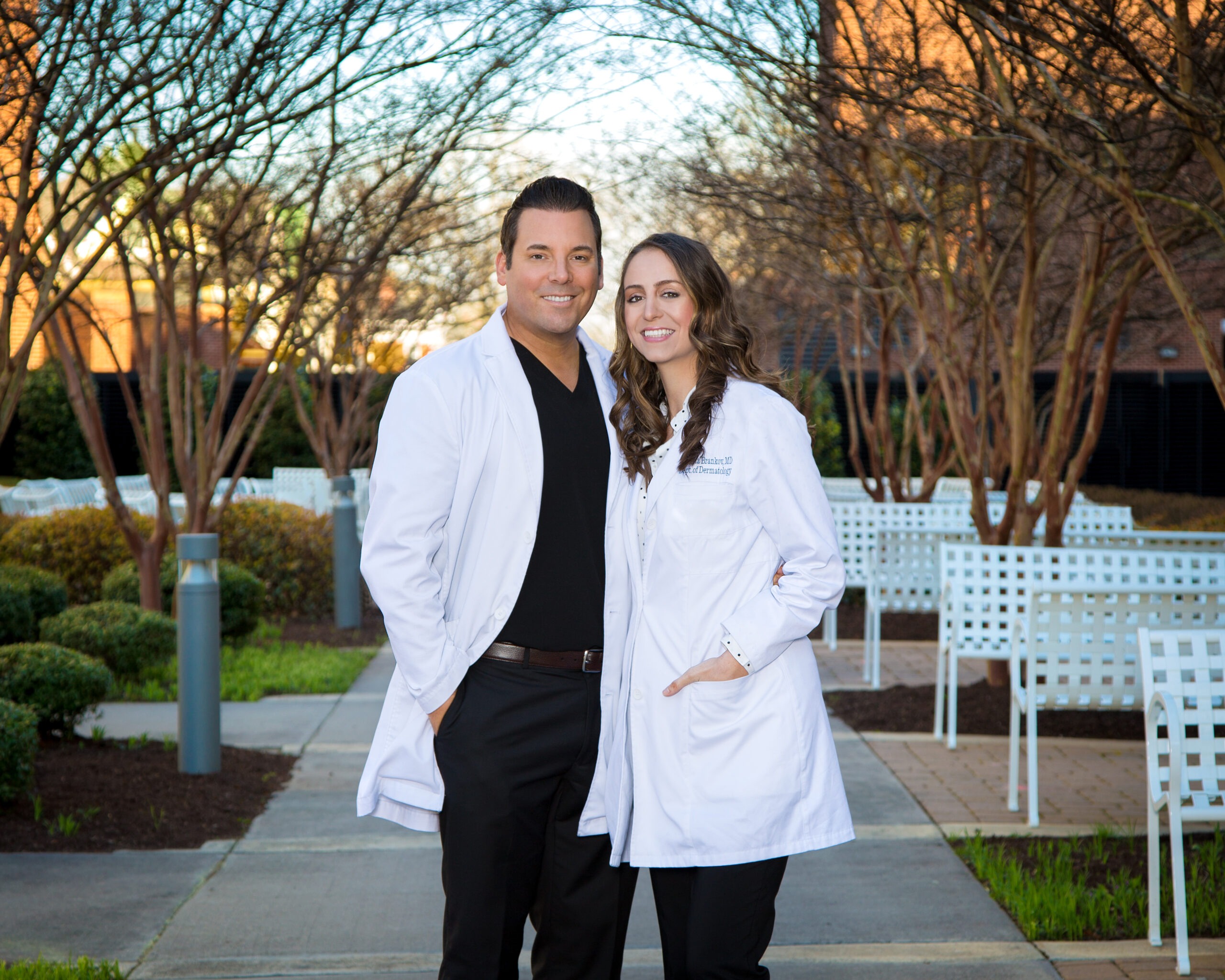 Dr. Eddy & Dr. Nikoleta outside in lab coats